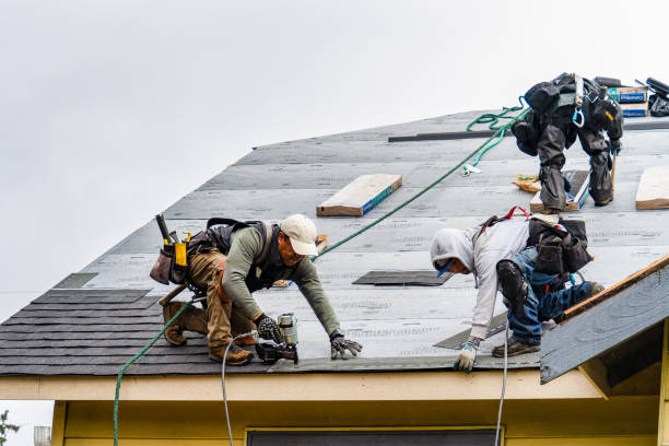 Professional Roofing technician working in Bandon, OR